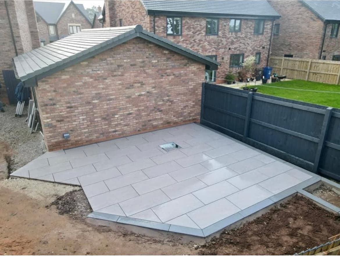 Completed porcelain patio project by Southwest Driveways and Roofing